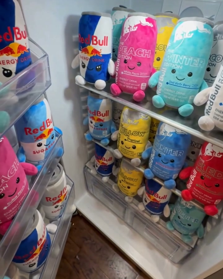 A fridge stocked with energy can plushies in every flavor