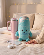 Real size: the Winter energy can plushie, about 25 cm, next to a 40 oz tumbler, an iPhone and AirPods